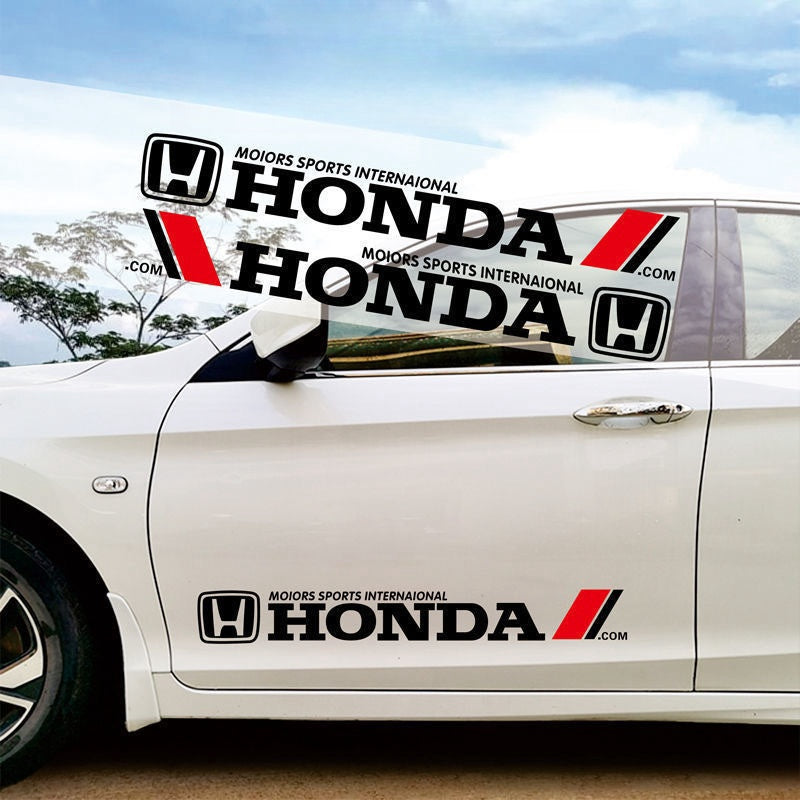 Dramatic close-up of a high-performance forged racing wheel on a white Honda Civic Type R track car. Showcases the aggressive black spokes and red Honda Motorsports livery for ultimate street or show car style.